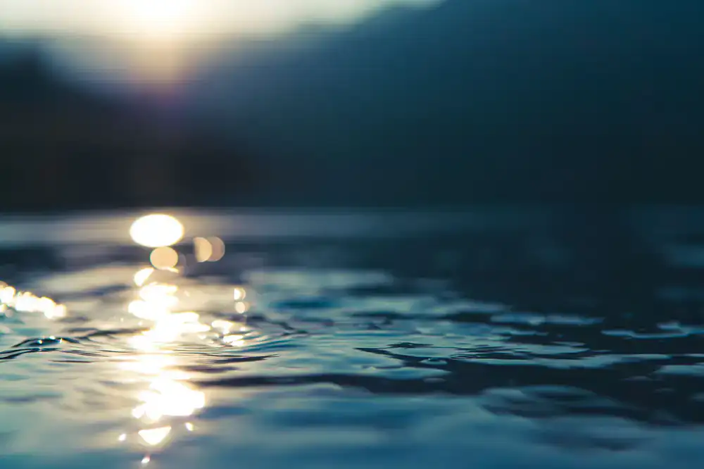 A breathtaking digital lake at sunrise with realistic water ripples