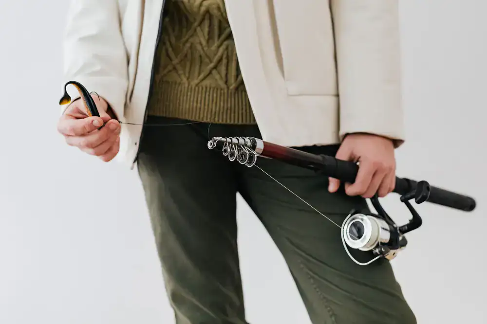 Player holding a broken fishing rod in-game needing assistance